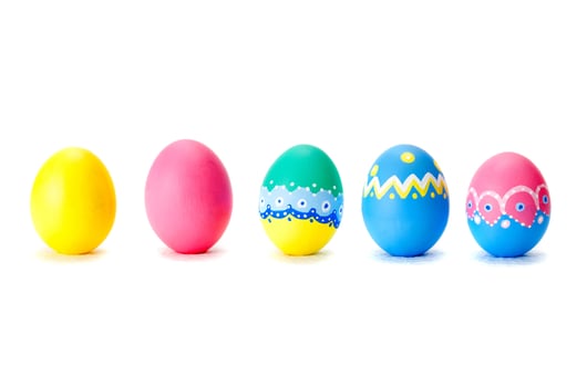 Colorful easter eggs in a row - isolated over a white background