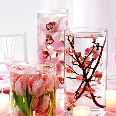Flowers-inside-vessels-full-of-water-and-placed-on-a-table.jpg
