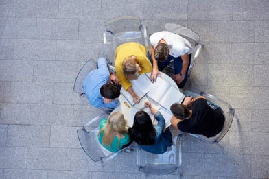 top view,  group of students together  at school table working homework and have fun